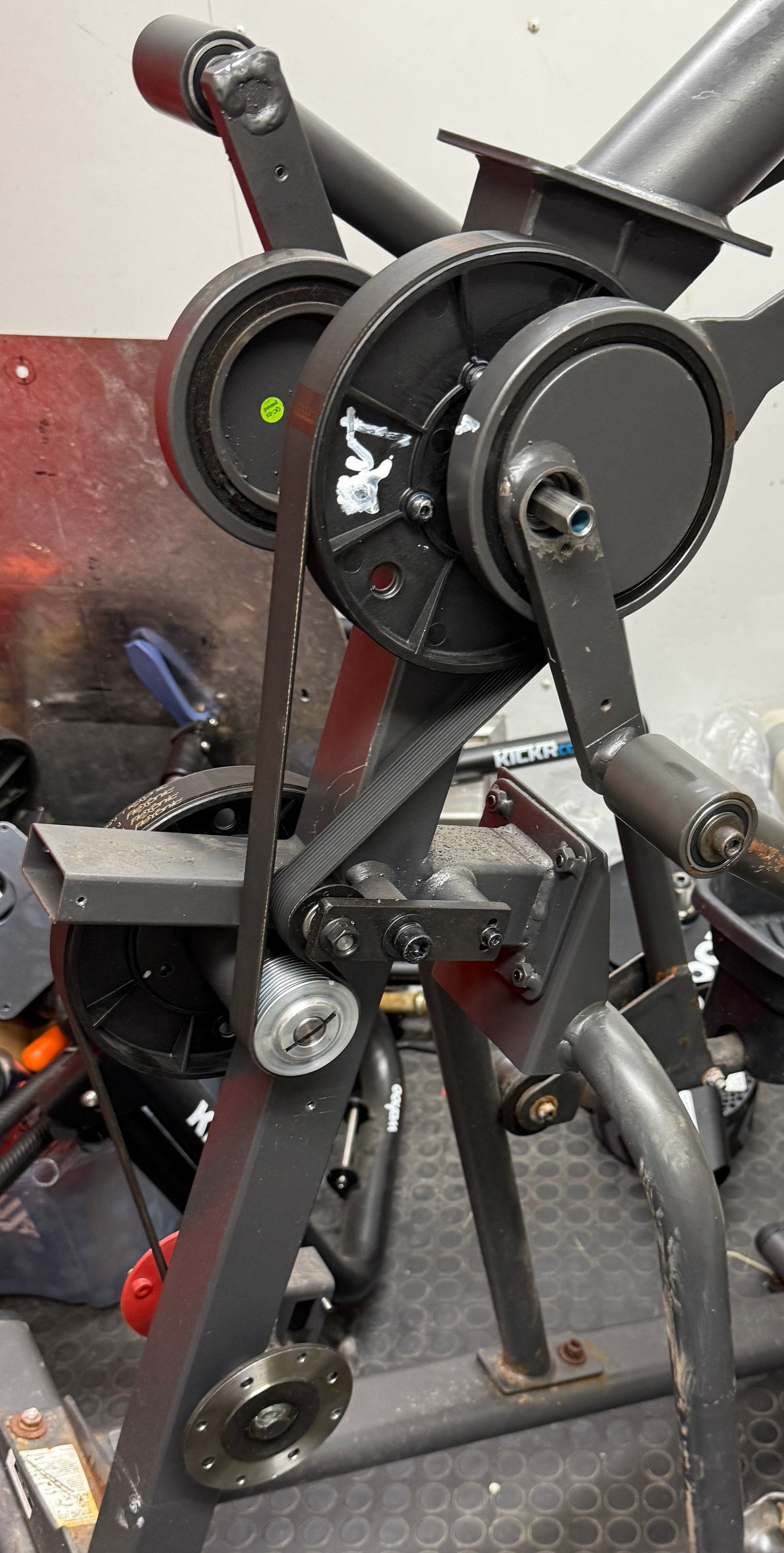Close view of the Bowflex Max crank, pulleys, belts, and Wahoo smart trainer in a prototype layout