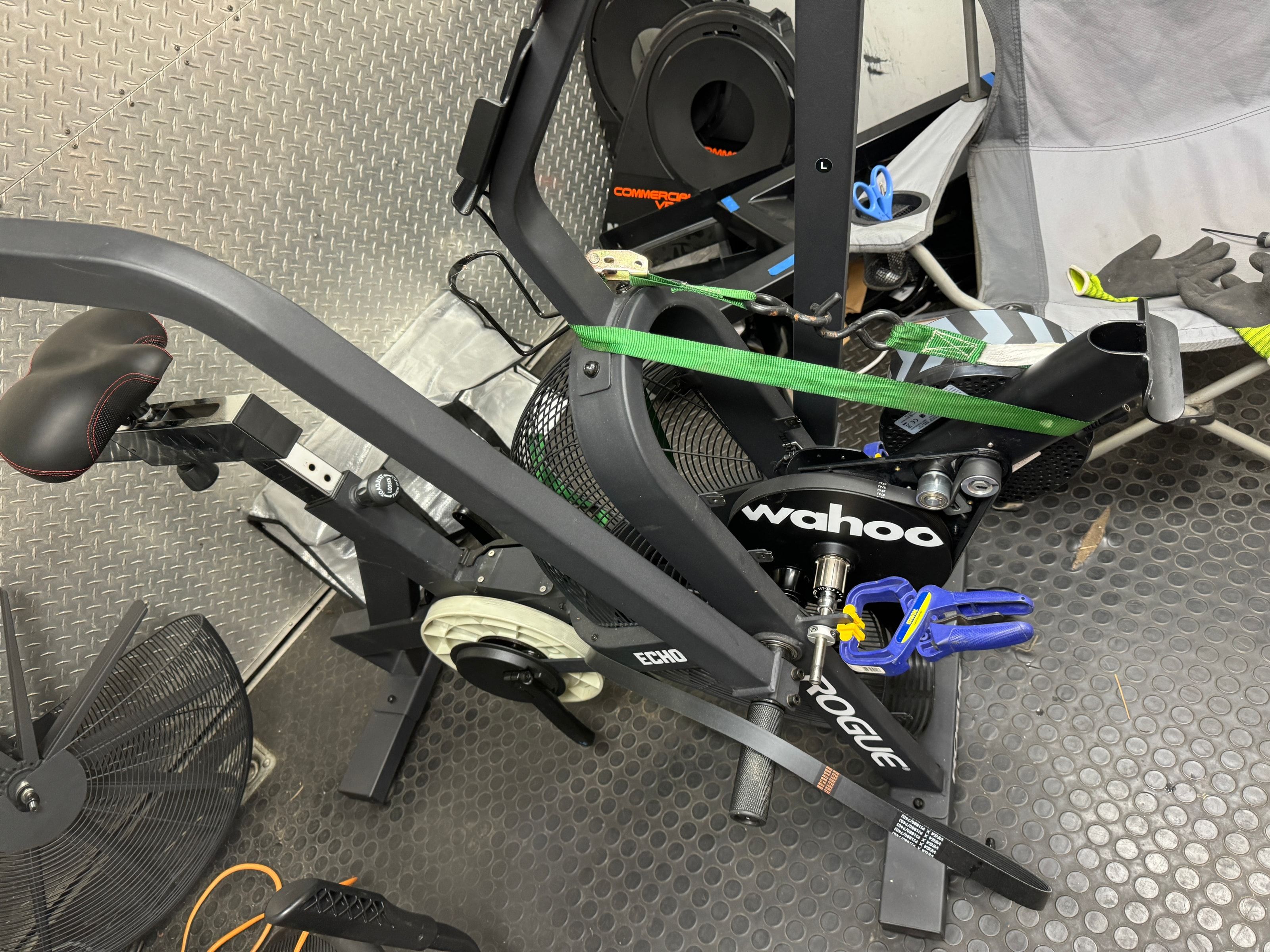 Rogue Echo Bike in a workshop with a Wahoo smart trainer temporarily mounted near the crank